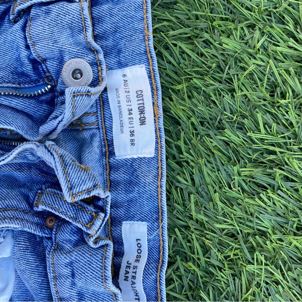 Cotton on baggy jeans with rips in knees